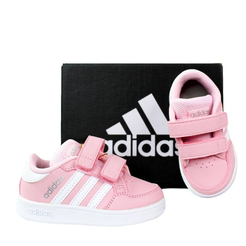 Scarpe bianche con riporti in rosa con lo strappo.Puma